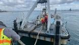 Navay salvage ship with aircraft wreckage
