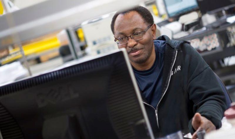 An AAR Corp. employee on the computer