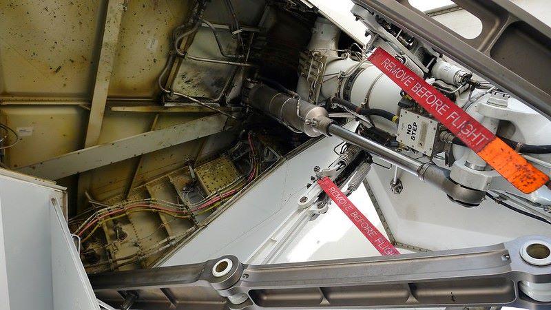 red strips that say remove before flight